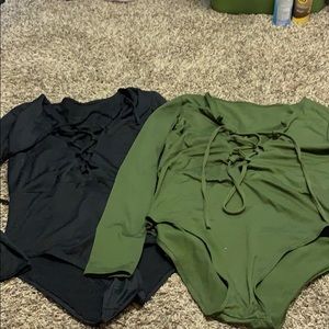 Two spandex body suits with cute criss cross ties